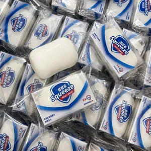 Detailed view of white soap-shaped squeeze toy in its individual packaging