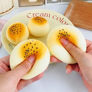 Soft cream-colored soufflé bun squishy toy for stress relief with realistic texture