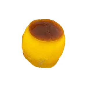 Realistic caramel pudding stress-relief squishy toy shown on a plain white background.