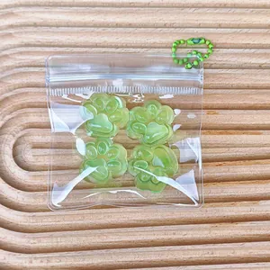 Vier mini grüne Katzenpfoten Squishy Anti-Stress-Spielzeuge in einem Klarsichtbeutel