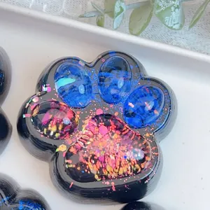 Detail of cat paw squishy stress relief toy with starry glitter effect