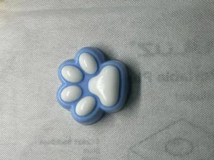 Detailed view of a cute blue and white cat paw shaped slow rebound squishy stress toy.