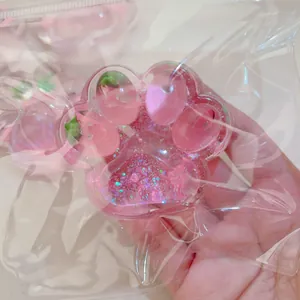 Cute pink strawberry cat paw squishy toy with glitter for stress relief detail view