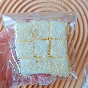 Close-up of white simulation food squishy toy cubes with textured finish in a clear bag