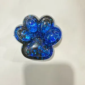 Sparkling blue glitter cat paw squishy toy with crystal clear finish for stress relief