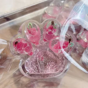 Close-up of a pink strawberry glitter cat paw squishy stress relief toy for kids and adults