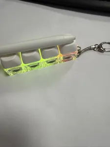 Close-up of a 4-key mechanical keyboard switch tester keychain with neon yellow base