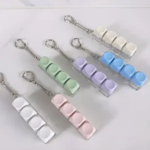Detailed view of 4-key mechanical keyboard switch tester keychains in macaron colors