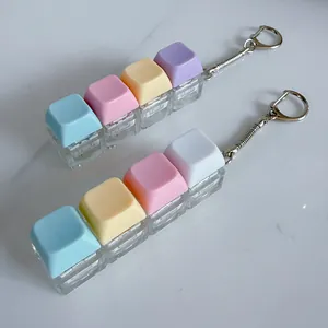 Close-up detail of macaron colored mechanical keycap fidget toy keychain on white surface