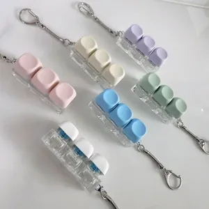 Macro detail of macaron colored mechanical switch tester keycaps in various pastel shades.