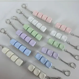 Detailed view of colorful Macaron mechanical keyboard switch tester keychains for stress relief