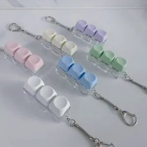 Close-up of colorful macaron mechanical keyboard switch tester keycaps on chains