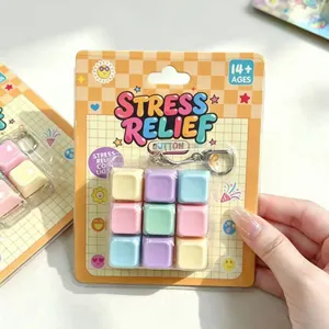 Detailed view of 9-key macaron stress relief toy with light-up buttons and keychain