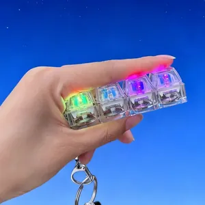 Detail of 4-key mechanical keyboard fidget toy with RGB LED lights held in hand