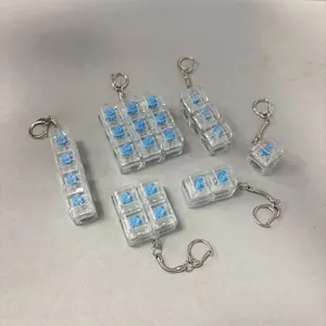 Transparent blue switch mechanical keyboard tester keychains in various grid layouts