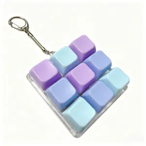 Detailed view of 9-key mechanical switch fidget toy keychain in pastel colors