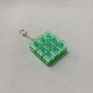 Transparent green 9-key mechanical switch fidget toy keychain for daily stress relief
