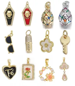 Assorted creative gold plated jewelry charms including heart, skull, and flower designs