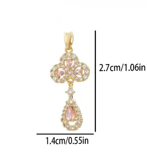 Detailed view of gold-plated pink crystal pendant showing dimensions 2.7cm by 1.4cm