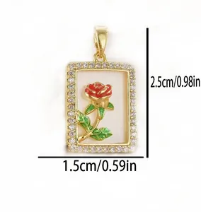 Detailed macro view showing 1.5x2.5cm dimensions of the gold-plated red rose pendant