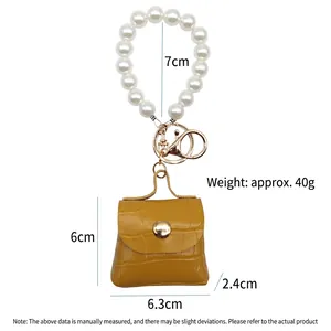 Colgante mini bolso de cuero PU amarillo con pulsera de perlas y cierre de mosquetón dorado.