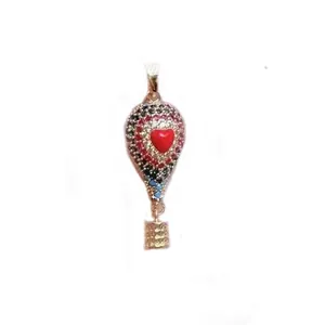 Detailed view of a hot air balloon pendant with a red heart and colorful stones