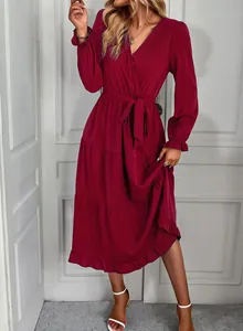 Elegant burgundy tiered maxi dress with long sleeves and adjustable tie waist design