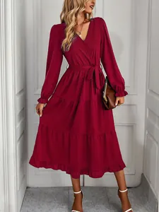 Elegant burgundy tiered maxi dress featuring a V-neck and ruffled long sleeves for women