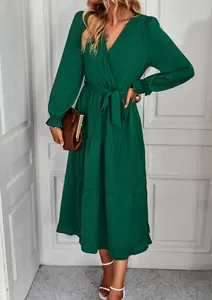 Elegant dark green tiered long sleeve midi dress with a waist tie and ruffle hem