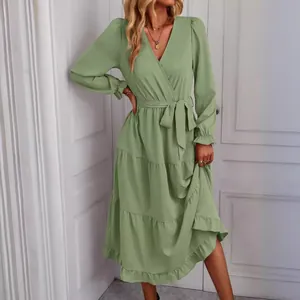 Elegant sage green wrap midi dress featuring long sleeves and a tiered ruffle skirt