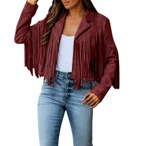 Detailed view of women's burgundy faux suede jacket with long fringe accents
