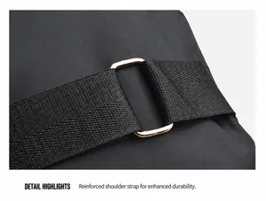 Detailed view of the reinforced shoulder strap hardware on a black nylon chest bag
