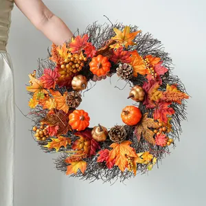 Handcrafted autumn wreath with maple leaves and pumpkins for harvest festival decor