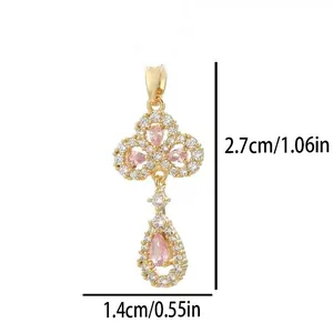 Elegant gold-plated clover and pear-shaped drop pendant set with pink and white crystals
