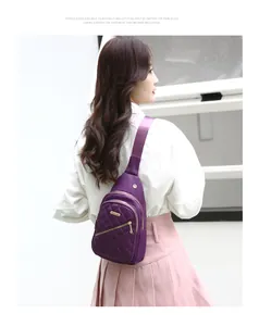 Back view of model wearing a stylish purple quilted nylon chest bag for outdoor travel