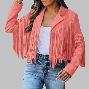 Detail view of women's coral suede jacket featuring western-style long fringes on sleeves