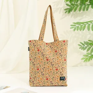 Detailed view of eco-friendly cork tote bag with bohemian floral print pattern