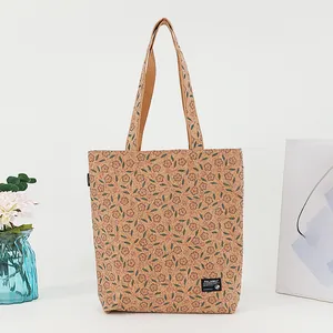 Eco-friendly cork tote bag featuring a vintage bohemian floral pattern and brand label