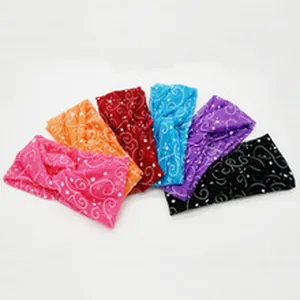 Detailed view of six multi-colored knotted headbands with swirl and star patterns