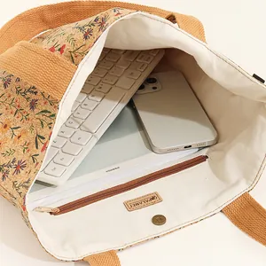 Detail view showing spacious interior of cork tote with floral pattern and magnetic clasp