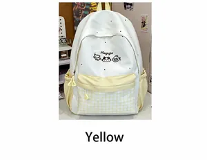 Close-up view of a cute embroidered white backpack with yellow checkered pattern and cat detail