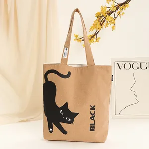 Close-up detail of eco-friendly cork bark shoulder tote bag with cute black cat print