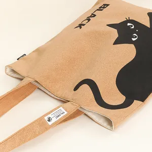 Detail of cork texture and cat print on an eco-friendly bark tote bag.