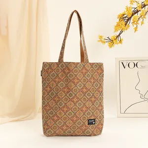 Close-up detail of a Bohemian style cork tote bag with geometric patterns and shoulder straps