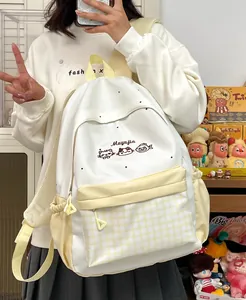 Cute white and yellow student backpack with cat embroidery and plaid pocket detail