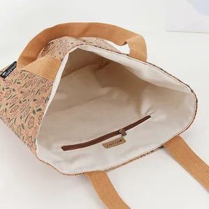 Close-up interior of eco-friendly cork tote bag with zipper pocket and brand label