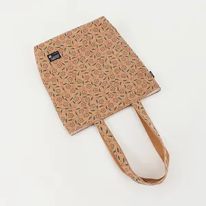 Top-down detailed view of an eco-friendly cork tote bag with floral print design