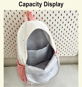 Detailed macro view showing the spacious main interior compartment of this cute schoolbag
