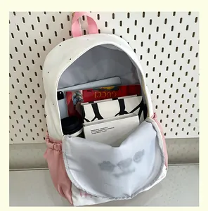 Inside view of a cute pink color-block backpack showing large capacity for books
