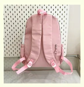 Detailed back view of a pink and white school backpack with padded adjustable straps